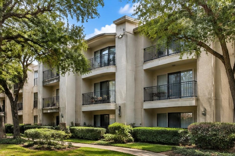 Illustrative Class A stucco garden apartments with patio glass doors