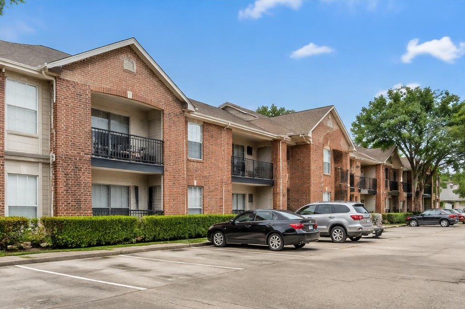 Illustrative Class B two-story brick apartments with established landscaping