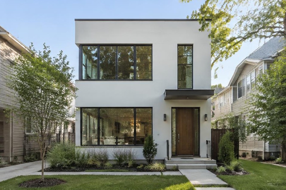 Compact two-story modern home with large black-framed windows