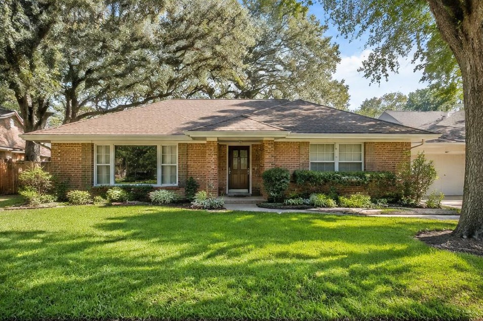 One-story brick ranch home with a large front picture window