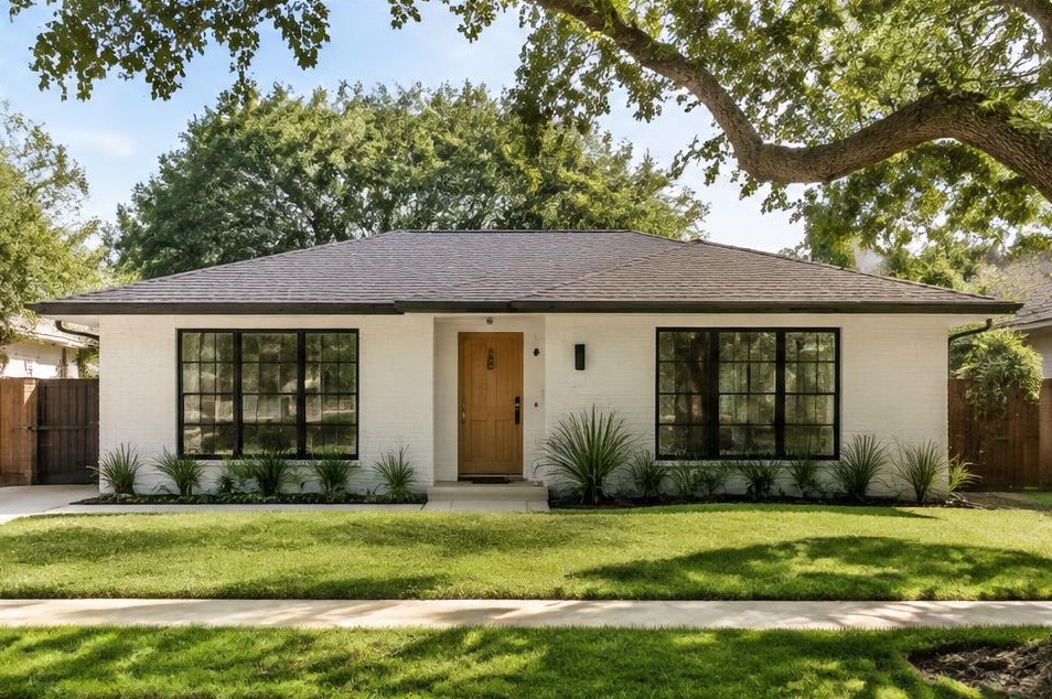 Modest painted-brick ranch with contemporary black-framed windows